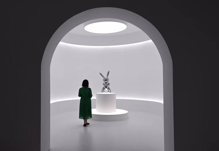Image: A woman looks at Jeff Koons' "Rabbit" from the Masterpieces from The Collection of S.I. Newhouse at Christie's New York press preview,