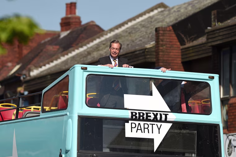 Image: Brexit Party leader Nigel Farage rides on their bus during a visit campaigning for the European Parliament election in Pontefract, northwest England