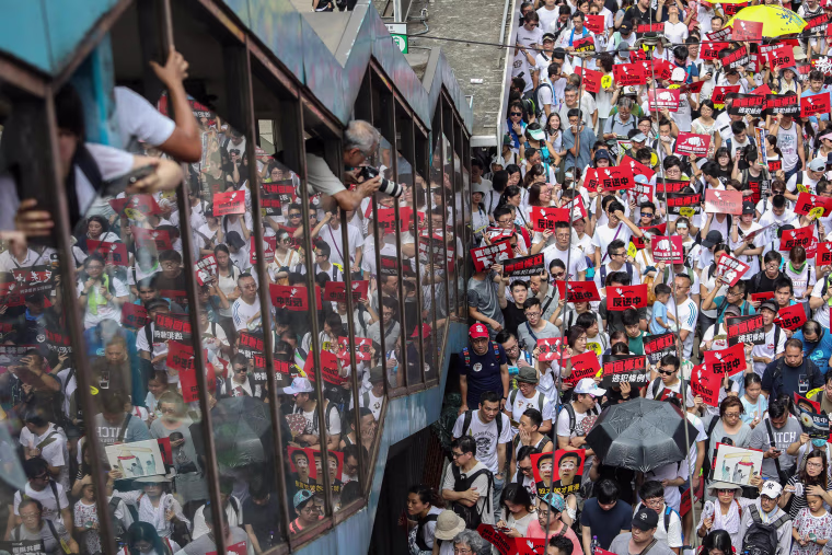 Image: Protesters flood the streets of Hong Kong on Sunday