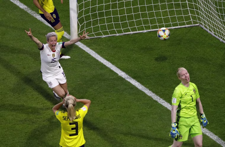 Image: Megan Rapinoe, left, celebrates after Tobin Heath scored her side's second goal during the Women's World Cup Group F soccer match between the U.S. and Sweden