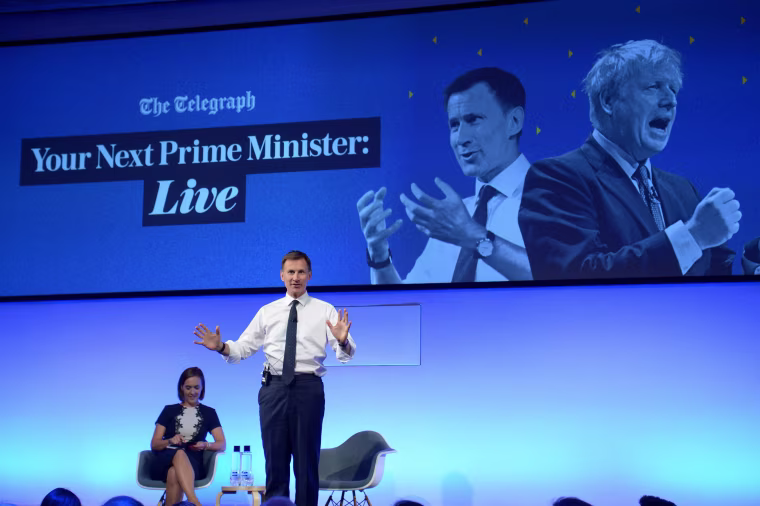 Image: Conservative leadership candidate Jeremy Hunt gestures as he speaks in London on July 8.