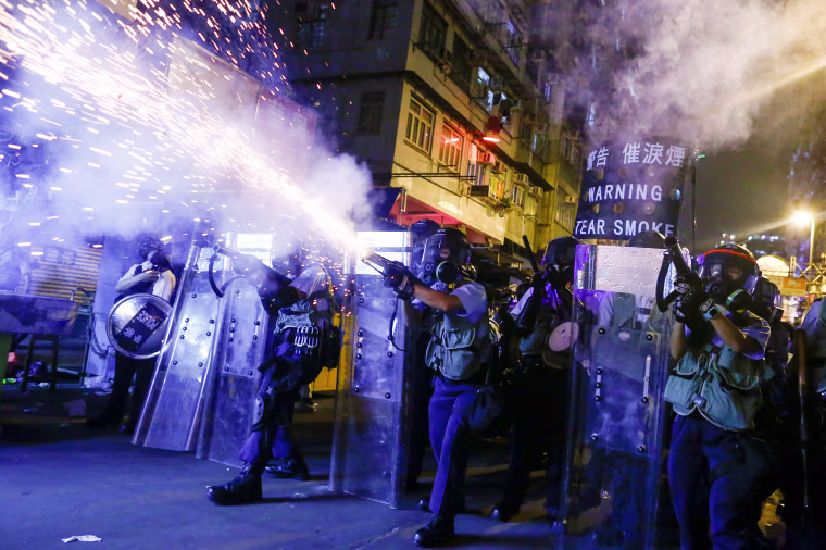 Police fire tear gas at anti-extradition bill protesters during clashes in Sham Shui Po in Hong Kong on Aug. 14, 2019.