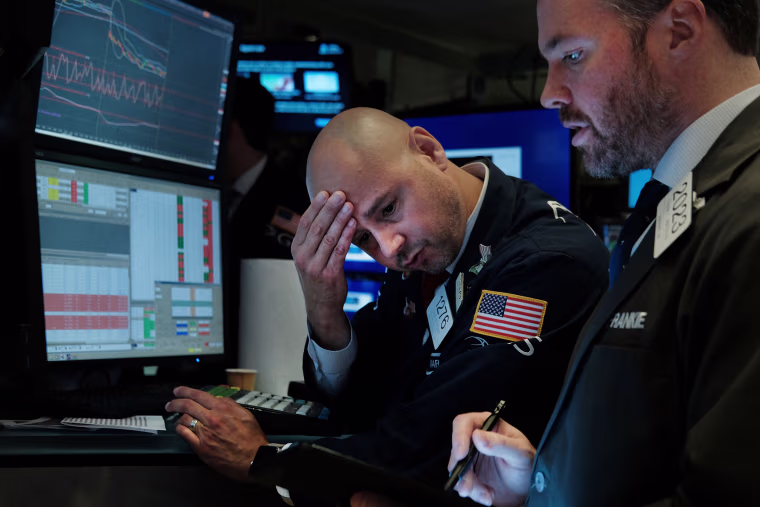 Traders work on the floor of the New York Stock Exchange on Aug. 14, 2019. Following news of an economic slowdown in both Germany and China, concerns over a recession in America sent stocks plummeting with the Dow down over 800 points.