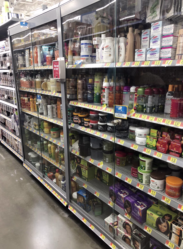 Black beauty and hair products in locked cases inside a Walmart in Ontario, California.