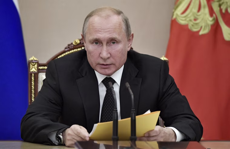 Image: Vladimir Putin speaks at a meeting with members of the Security Council in the Kremlin on Friday.