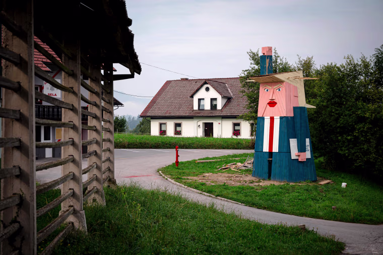 Image: A wooden structure resembling President Donald Trump in the village of Sela pri Kamniku, Slovenia, on Aug. 29, 2019. The statue, designed by local artist Tomaz Schlegl, stands nearly 26 feet tall.