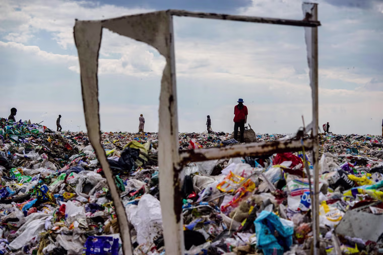 Image: Recyclers are seen scouring Richmond sanitary landfill site for material in Zimbabwe.