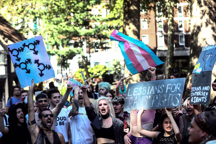 Image: Protestors chant during the first ever Trans Pride March in London
