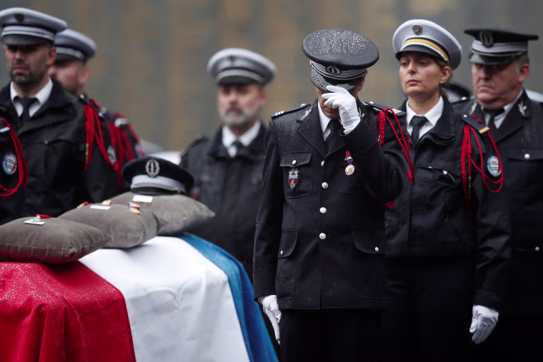 Image: French Police officers attend a ceremony to honour four victims of Paris police attack