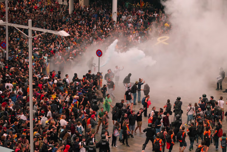 Image: Protesters clash with Spanish policemen outside El Prat airport in Barcelona on Oct. 14, 2019.