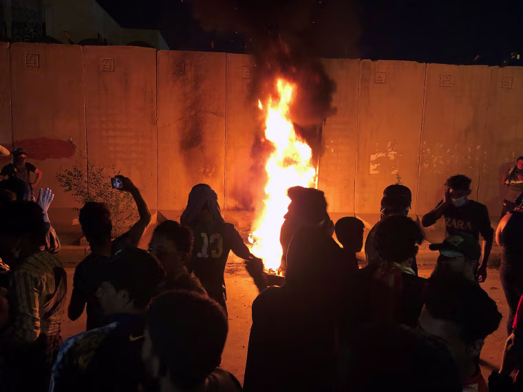 Image: Demonstrators set fire to front of the Iranian consulate in Karbala Iraq 