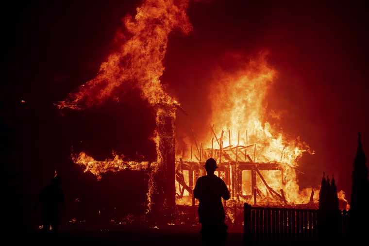 Image: A home burns as the Camp Fire rages through Paradise, Calif.