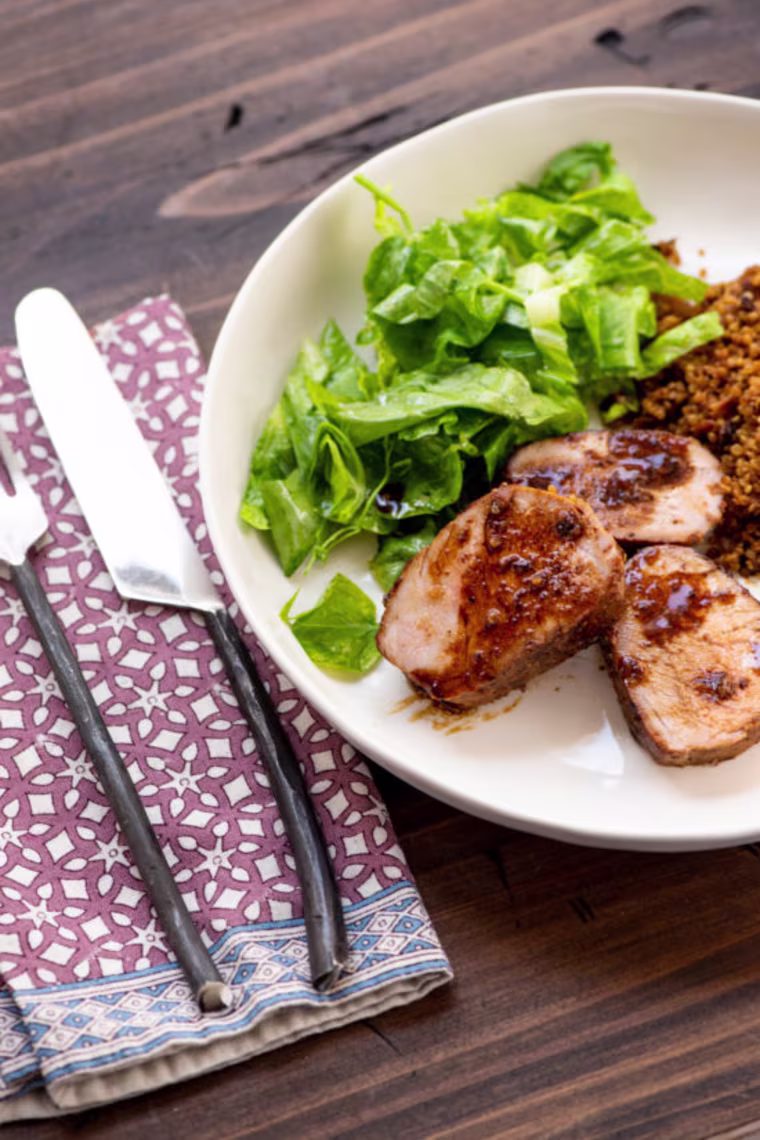 A small handful of ingredients turns inexpensive pork loins into a terrifically flavorful main course.