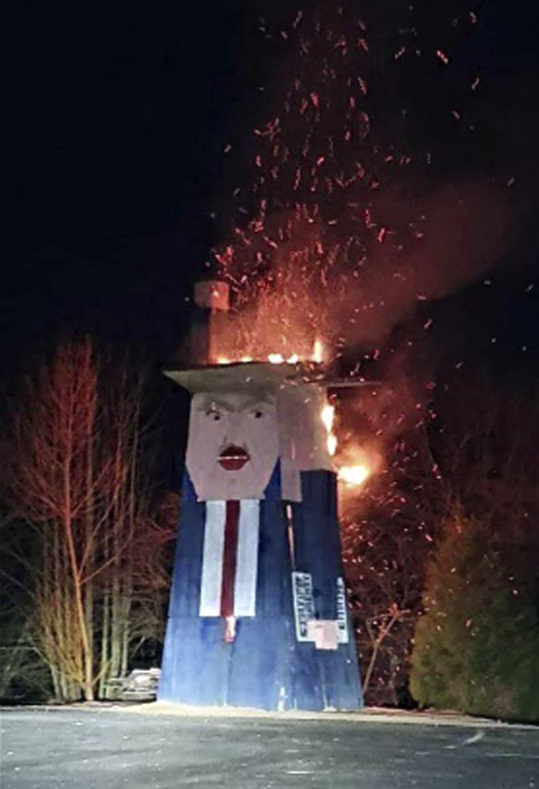 Image: Donald Trump wooden sculpture burned