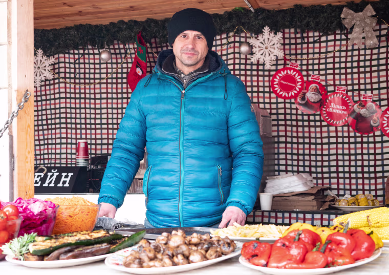 Image: Oleksandr Potapenk, 44, a Christmas market vendor in Kyiv.