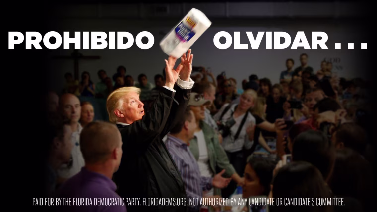 Image: A billboard installed by Democrats in Kissimmee, Florida shows President Donald Trump throwing paper towels to residents of Puerto Rico following Hurricane Maria.