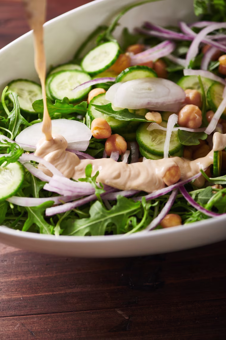 Tahini is a thick sauce or paste made from sesame seeds.
