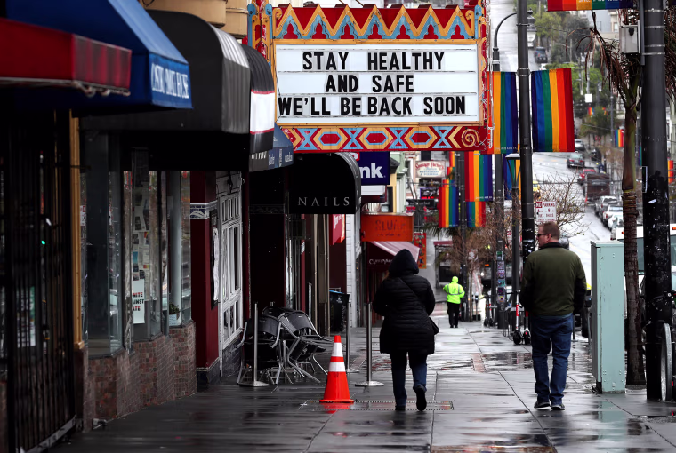 Image: Pedestrians walk by the Castro Theatre in San Francisco