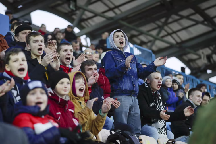 Young fans react during a Belarus soccer match on March 27. Longtime Belarus President Alexander Lukashenko is proudly keeping soccer and hockey arenas open even though most sports around the world have shut down because of the coronavirus pandemic.