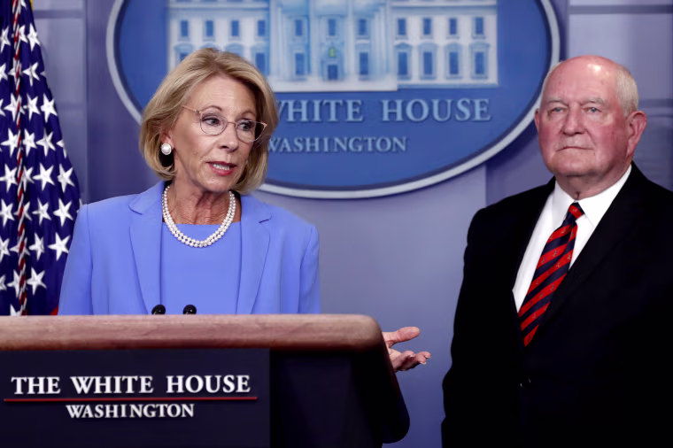 Education Secretary Betsy DeVos speaks about the coronavirus at the White House on March 27, 2020. DeVos imposed new Title IX regulations this month.