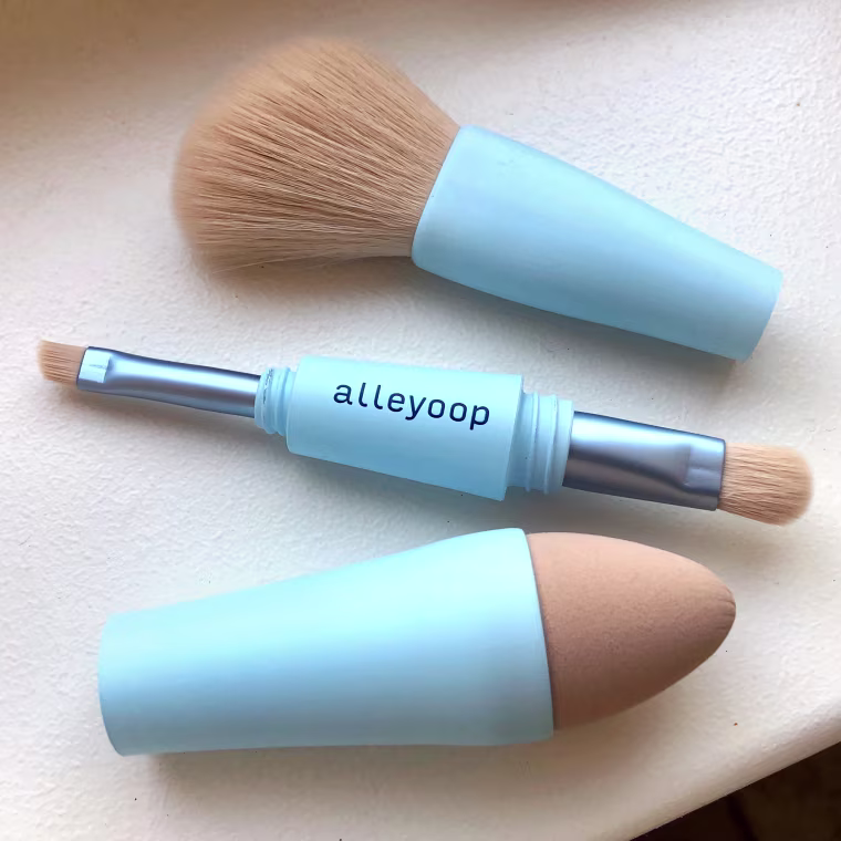 The tool includes a powder brush, a blending sponge, a medium shadow brush and an angled brow brush. 