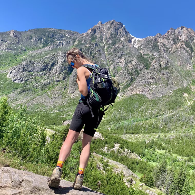Wearing black ODODOS workout shorts with tummy control while hiking in Montana