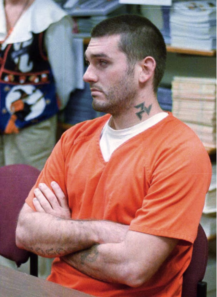 Image: Daniel Lee Lewis waits for his arraignment hearing for murder in the Pope County Detention Center in Russellville, Ark. on Oct. 31 1997.