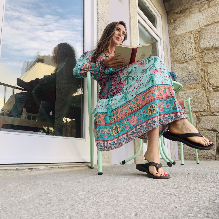 wearing the R. Vivimos dress while reading on my balcony