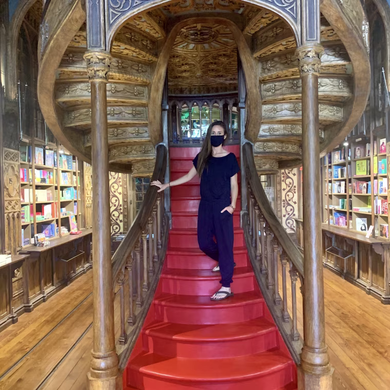 Wearing my off-shoulder jumpsuit in Livraria Lello