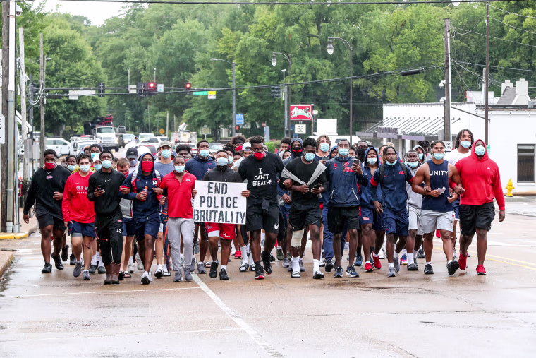 Ole Miss Football players marched from The Manning Center on the Ole Miss Campus to the Oxford Square on Aug. 28th, 2020 in Oxford, Miss.