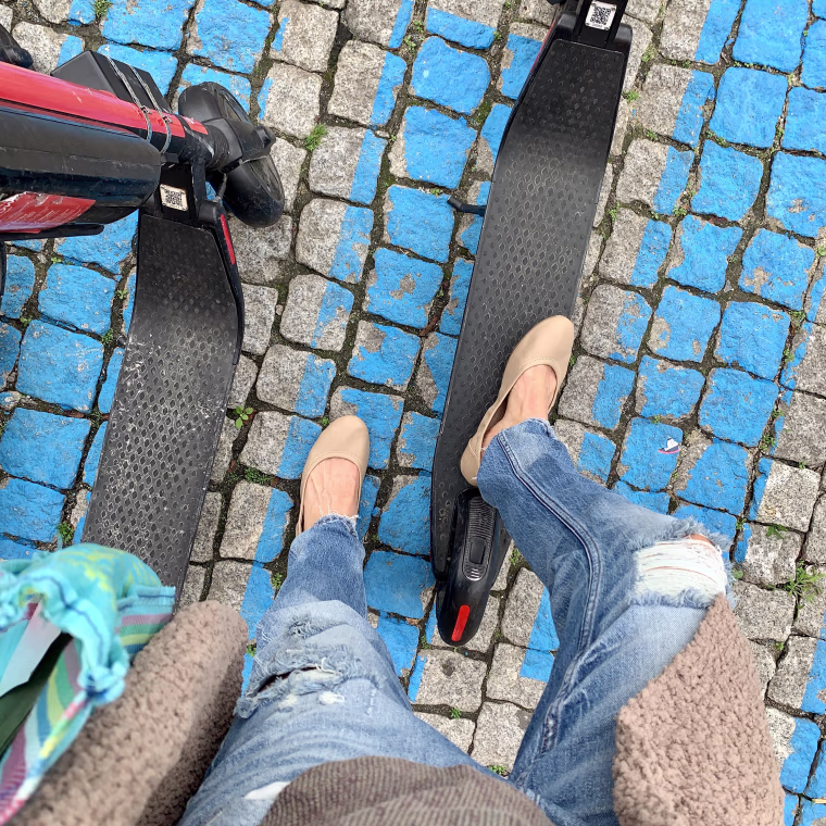wearing my Amazon Essentials ballet flats while getting ready to scooter