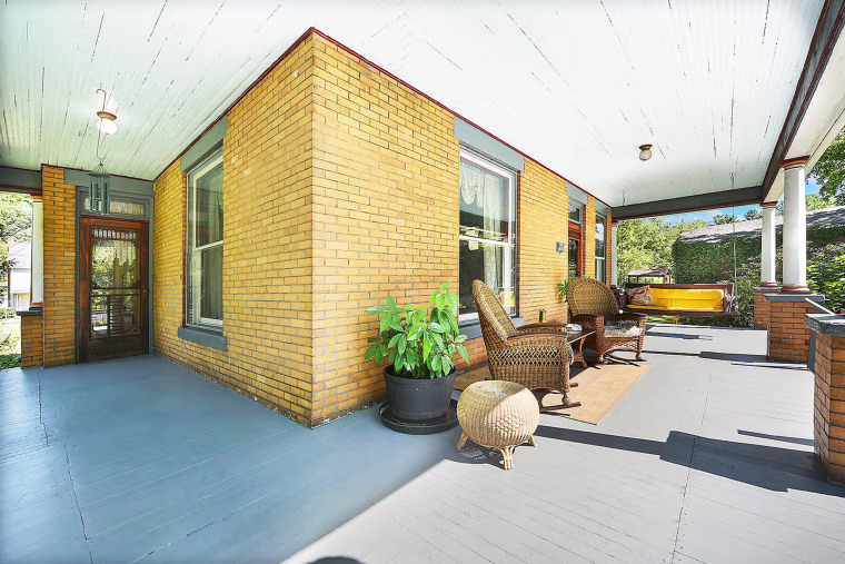 The sprawling property includes plenty of outdoor space and a newly finished porch.