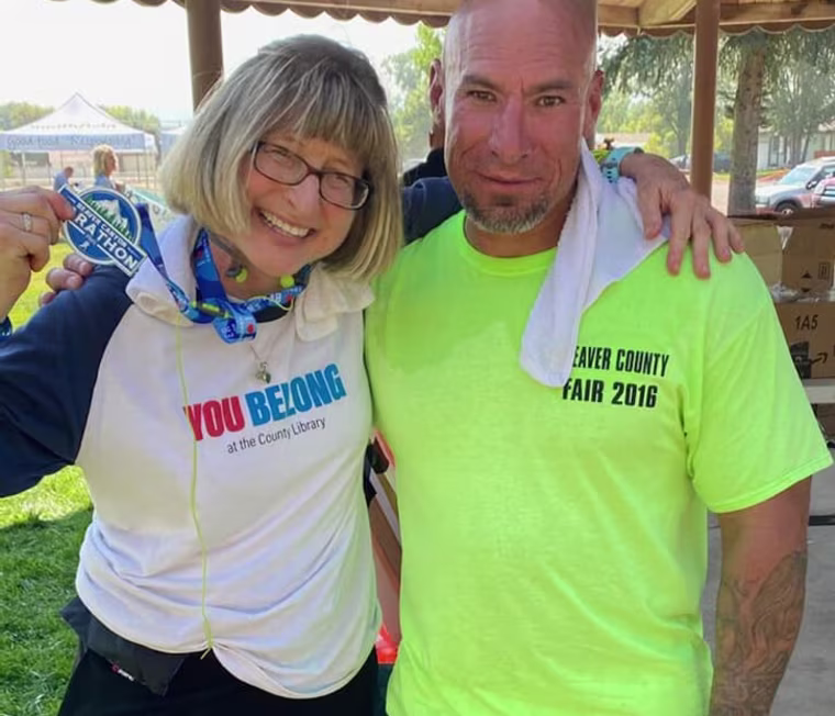 Carrie Kelley with Fidel Ybarra after finishing the Beaver Canyon Marathon on Oct. 3, 2020.