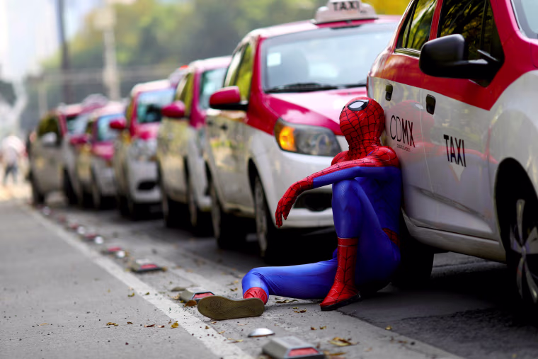Image: Taxi drivers hold a protest against taxi-hailing apps such as Uber, Cabify and Didi at Angel de la Independencia monument, in Mexico City