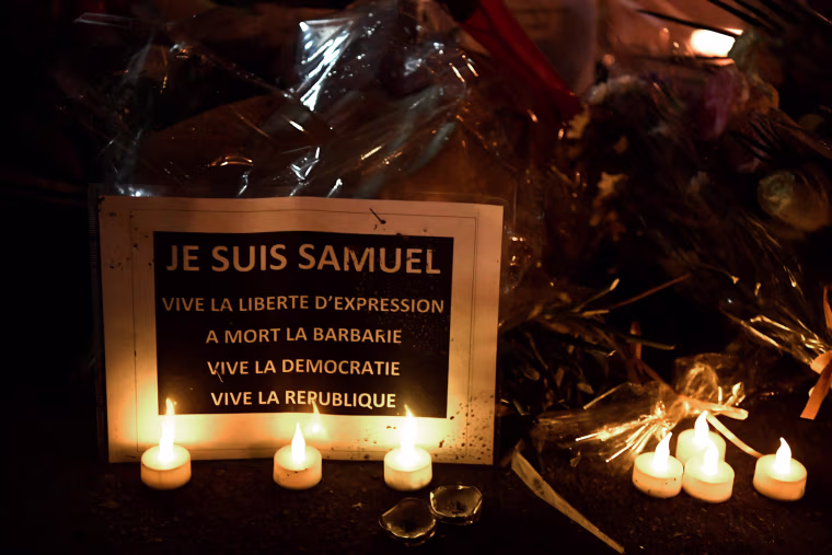 Image: The 'Marche Blanche' in Conflans-Sainte-Honorine, northwest of Paris, shows a sign reading 'I am Samuel'