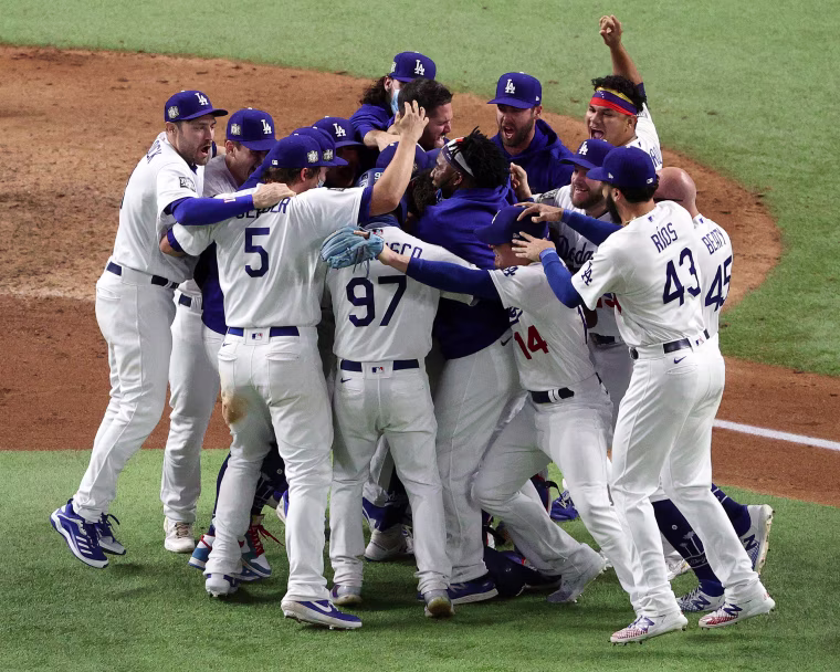 Image: The Los Angeles Dodgers celebrate after defeating the Tampa Bay Rays 3-1 in Game Six to win the 2020 MLB World Series at Globe Life Field