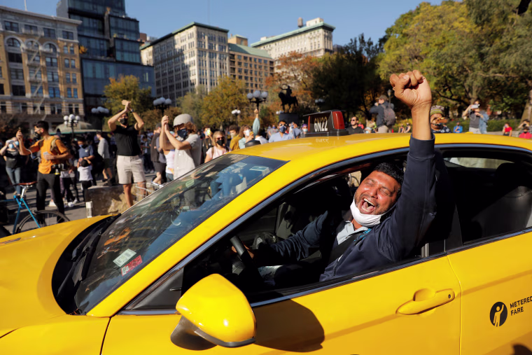 Image: People celebrate media announcing that Democratic U.S. presidential nominee Joe Biden has won the 2020 U.S. presidential election on Union Square in the Manhattan borough of New York City