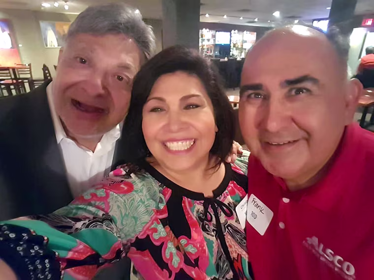 Dr. Fitz, left, with his friend of more than 15 years, Christy Martinez-Garcia, and her husband, Frank Garcia.