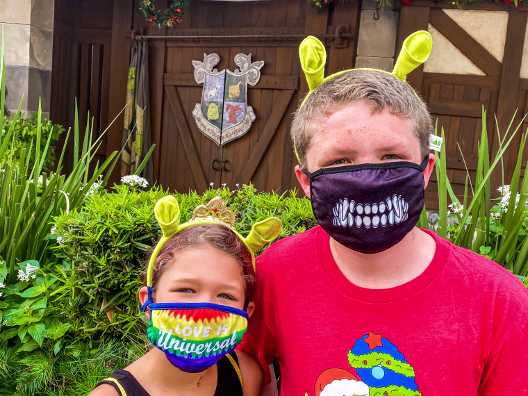 Saving on gas and groceries with Walmart Plus gives me the opportunity to buy special treats for my kids, like these "Shrek" ears they desperately wanted during our Universal day trip.