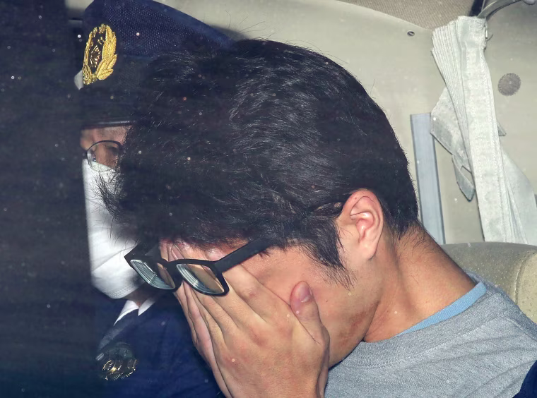 Image: Takahiro Shiraishi leaves a police station in Hachioji, suburbs of Tokyo
