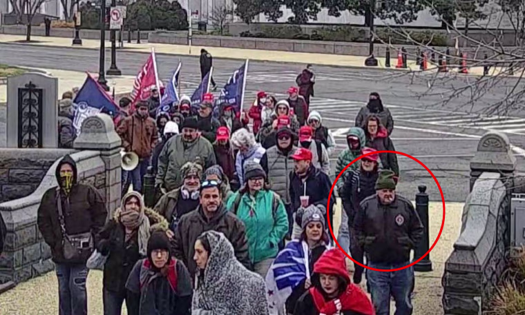 Lonnie Coffman, circled in red, with Trump supporters in Washington on Jan. 6, 2021, in an image from surveillance video.