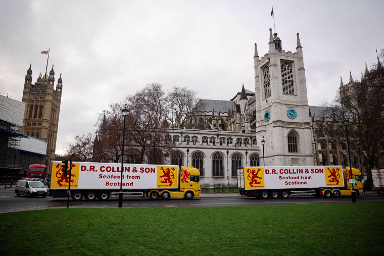 Image: Lorries from Scottish seafood companies drive past the Houses of Parliament in a protest action by fishermen against post-Brexit red tape and coronavirus restrictions, which they say could threaten the future of the industry, in London