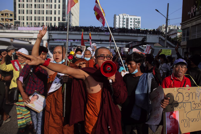 Image: Buddhist monks take part in a demonstration against the military coup in Yangon on Tuesday.