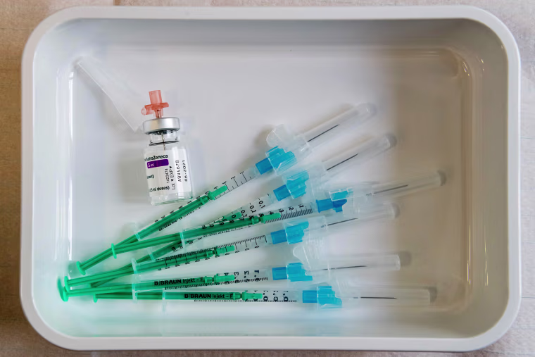 Image: A vial containing the AstraZeneca Covid-19 vaccine is seen next to some syringes on a tray at the university hospital in Halle/Saale, eastern Germany