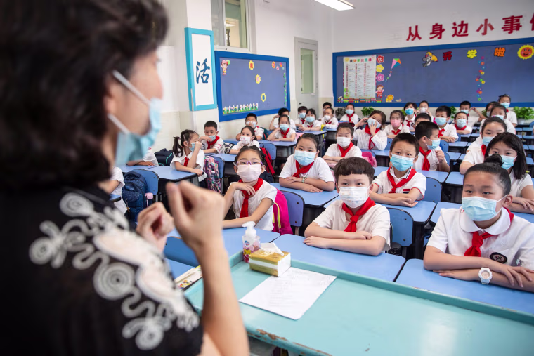Image: Elementary school students attending a class on the first day of the new semester in Wuhan in China's central Hubei province.