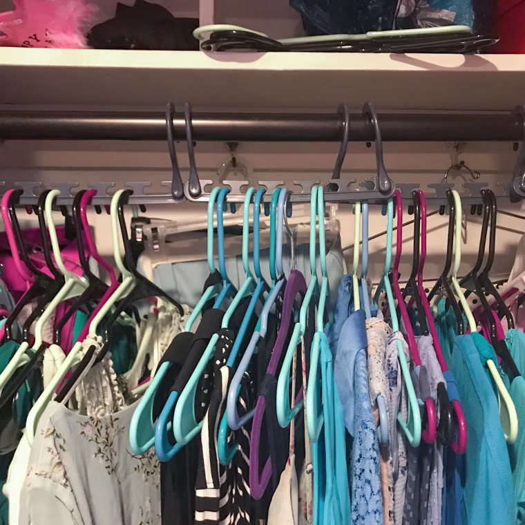 Chrissy Callahan shows her closet organized with Walmart organizer product 