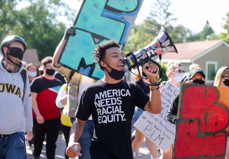 Image: Matè Muhammad leads protesters in a march in Des Moines, Iowa, on Aug. 15, 2020.