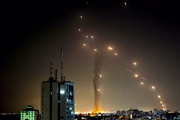 Image: A rocket launched from Gaza city controlled by the Palestinian Hamas movement, is intercepted by Israel's Iron Dome aerial defense system, on May 11, 2021.