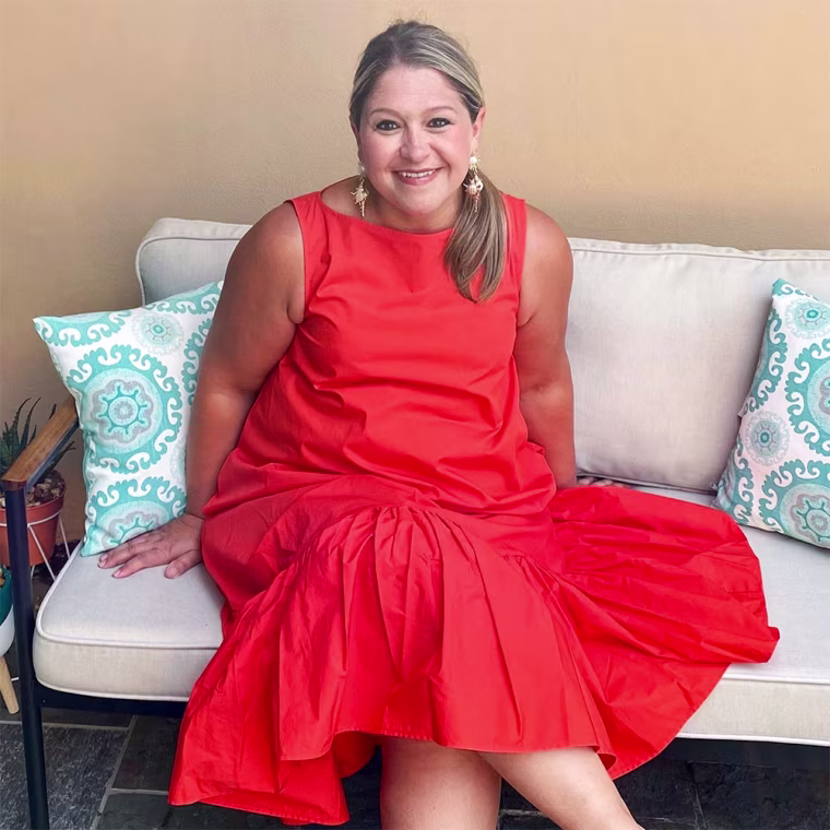Terri Peters wearing an orange designer dress from the Summer 2021 Target collection