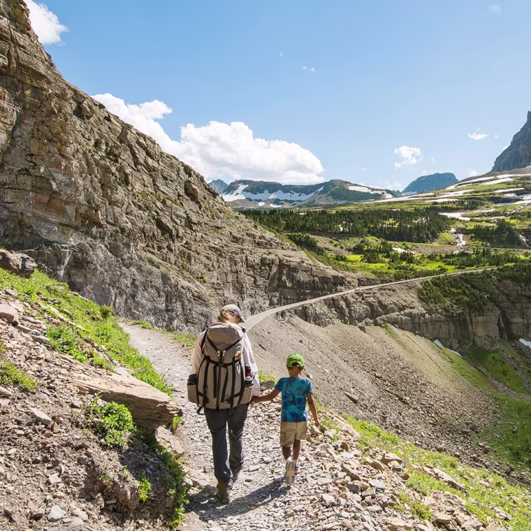 Mother and Son walking in Glacier National Park